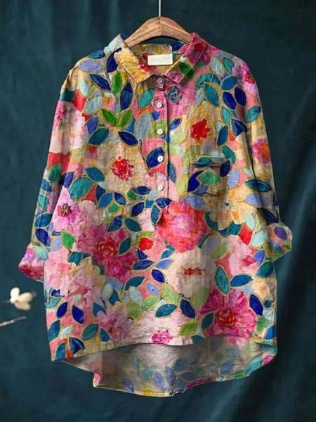 Tidløs langærmet blomstret bluse til fest og hverdag. Elegant feminin mode top til kvinder.
