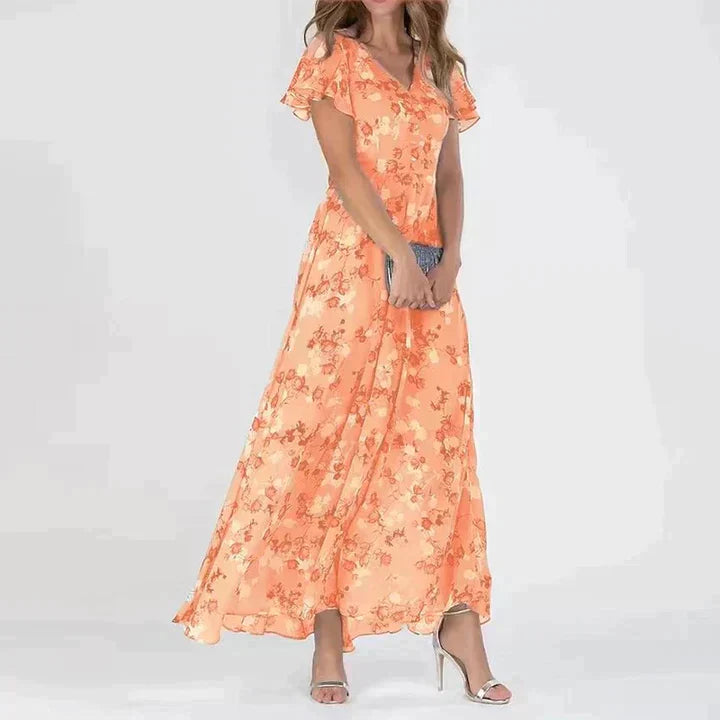 "Elegant blomstret maxi kjole med V-hals og flydende silhuet, ideel til kvinder, der søger et moderne og feminint look."