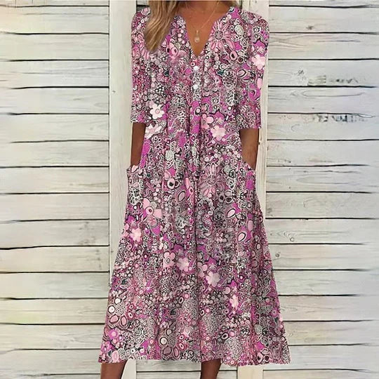 "Elegant blomstret midikjole, romantisk design med flatterende pasform, perfekt til specielle lejligheder."