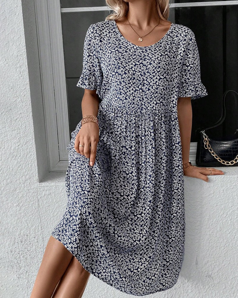 Elegant forårs- og sommerkjole: Blomstret midikjole til kvinder med feminint snit.