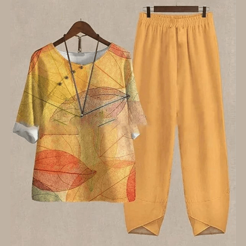 Kvinders elegant bluse og bukse sæt med moderne print, perfekt til både arbejde og fritid.
