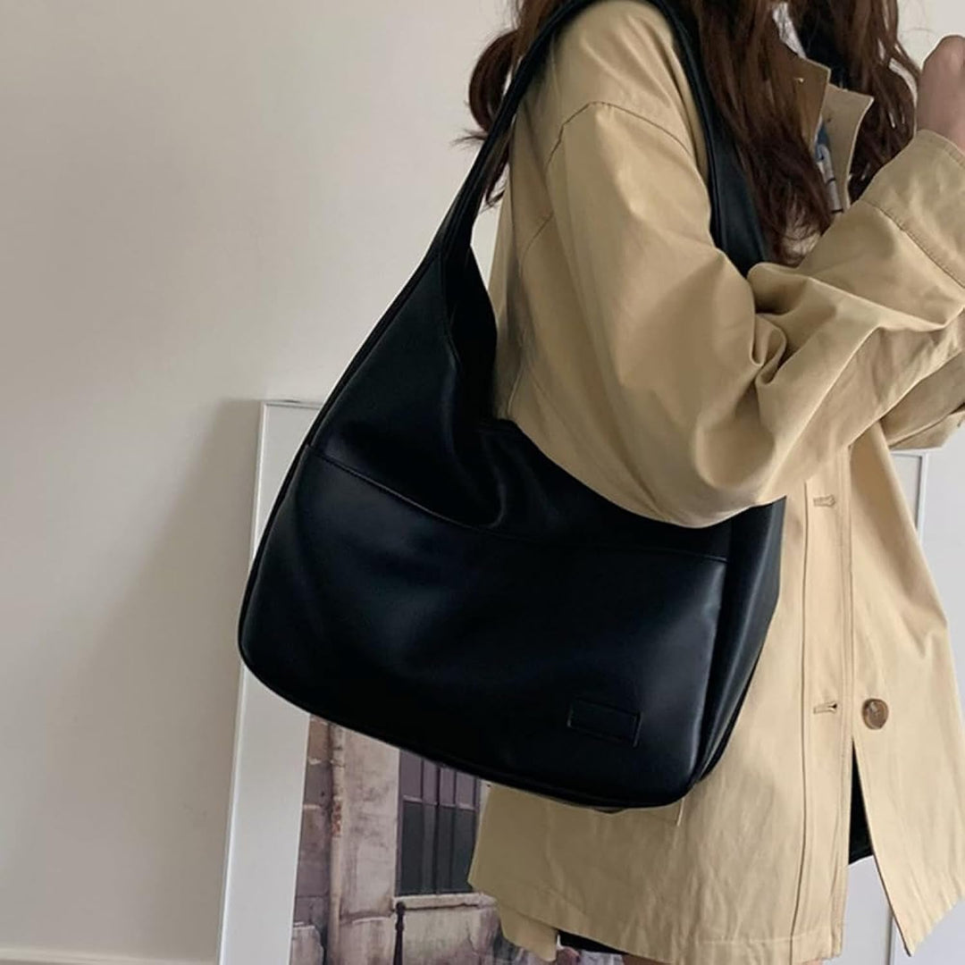 Tidløs skuldertaske i sort PU-læder. En alsidig og elegant dametaske med rummeligt design til kvinder.