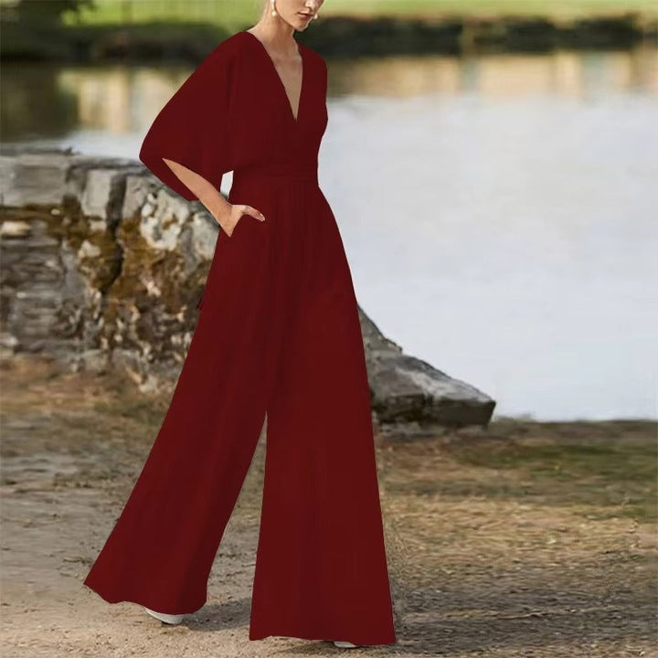 Daisy jumpsuit kvinder: Elegant V-hals, løs pasform, kortærmet for stilfuld sommerkomfort.