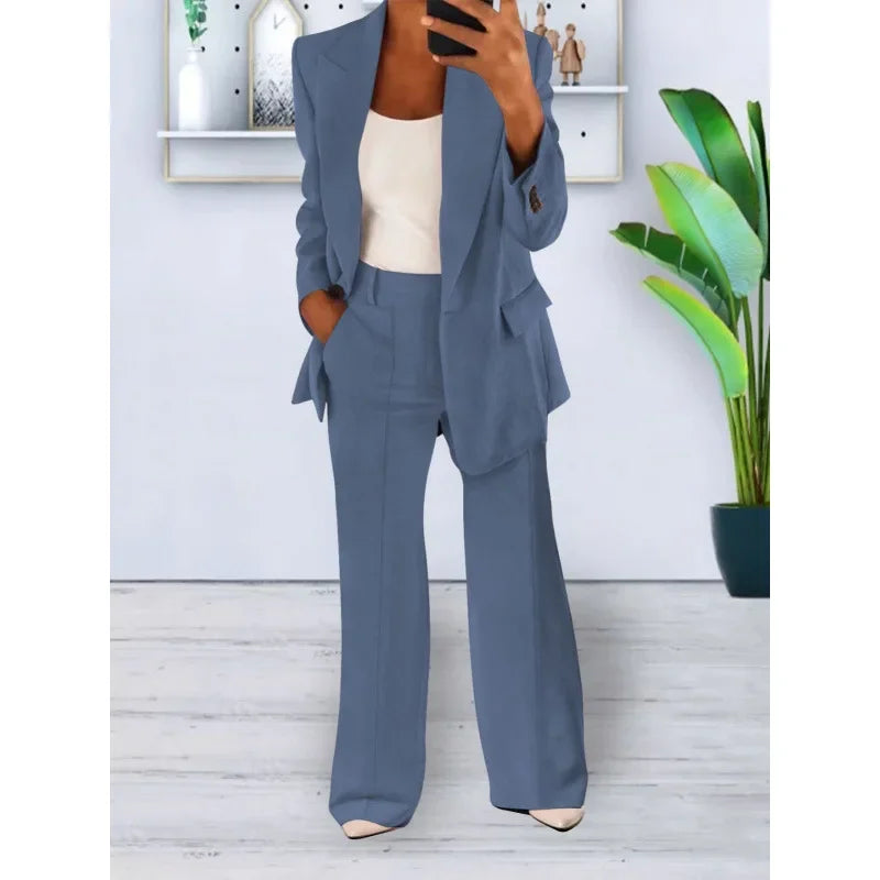 Elegant dame jakkesæt med blazer og vide bukser, perfekt til et stilfuldt og alsidigt outfit.