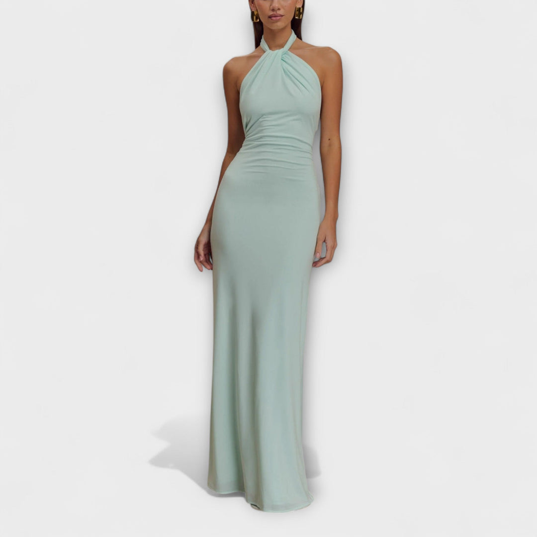 Elegant dame maxikjole med halterneck og åben ryg, perfekt som fest- eller gallakjole.