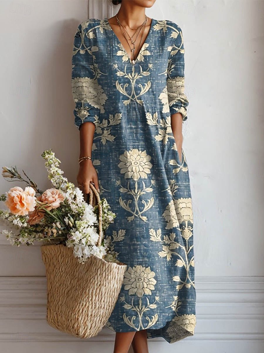 Elegant dame midi kjole i bohemestil med blomsterprint og V-hals, perfekt som sommerkjole til fest eller casual brug.