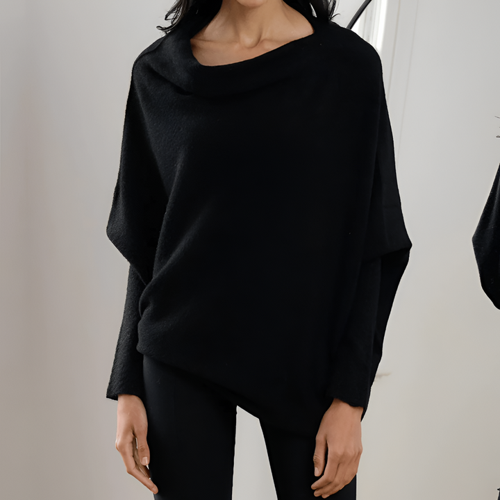 Feminin og moderne damebluse i oversize model. Med bådhals og løs pasform er den ideel til mange anledninger.
