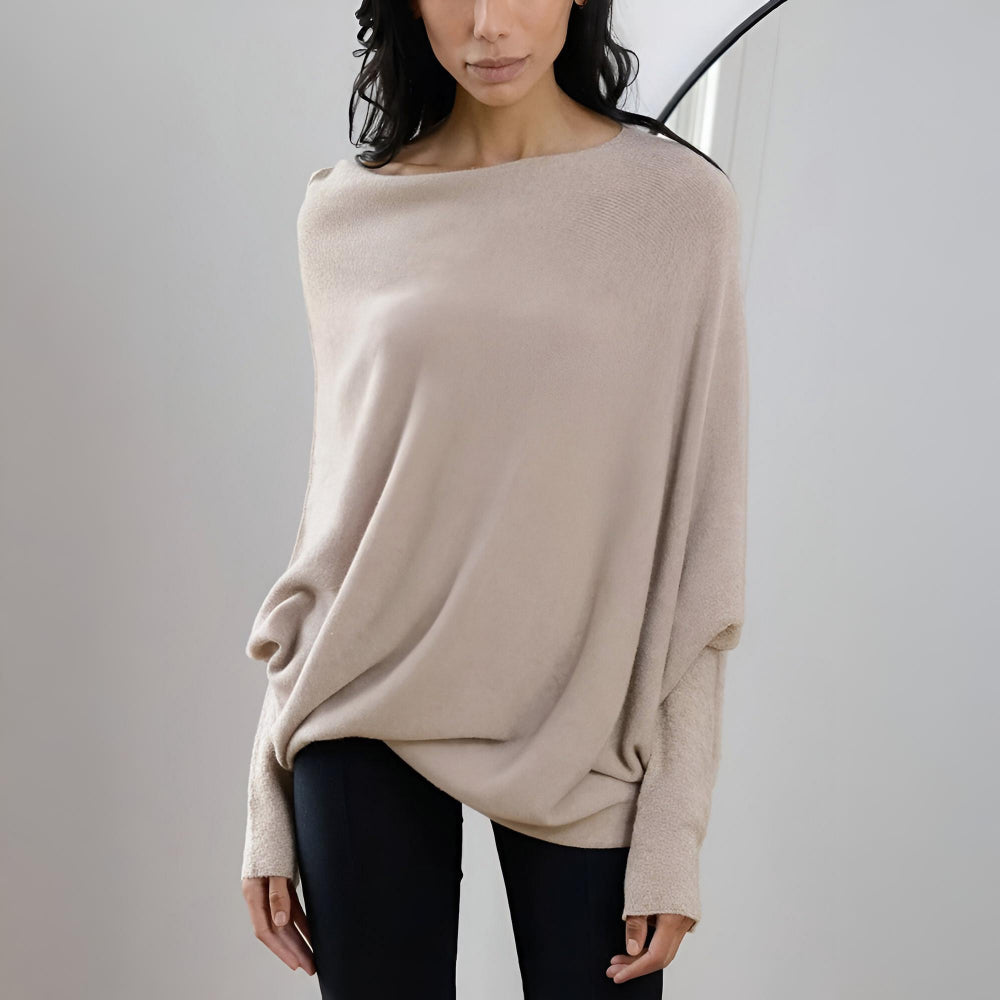Dame oversize bluse med klassisk bådhals. Denne elegante top tilbyder en moderne og afslappet silhuet.