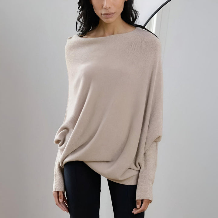 Dame oversize bluse med klassisk bådhals. Denne elegante top tilbyder en moderne og afslappet silhuet.