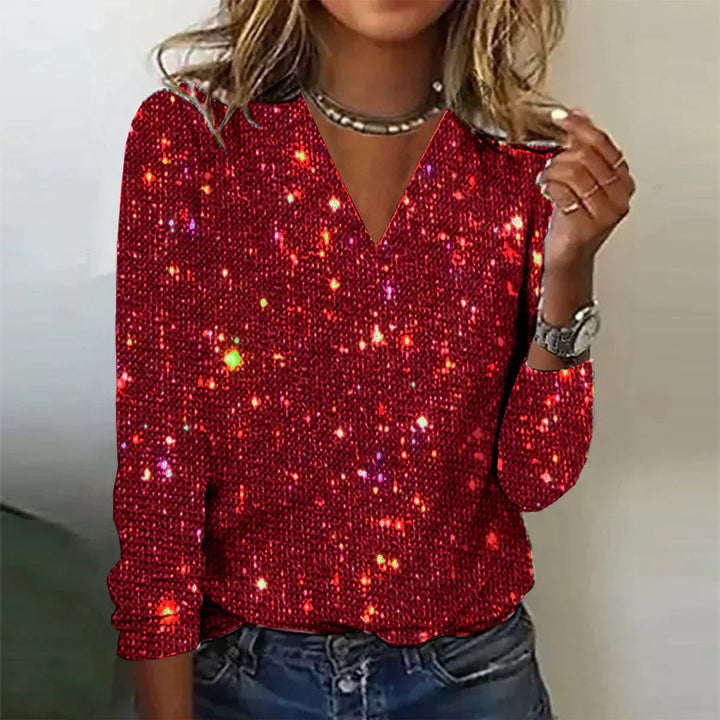Smuk langærmet paliet bluse til kvinder med V-hals. Ideel som glitrende festtøj og aftenmode.