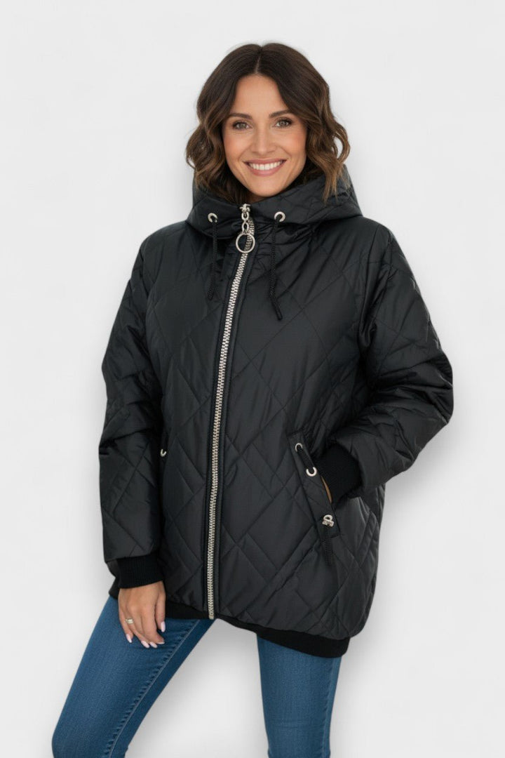 Luksuriøs dame parka, perfekt som varm vinterjakke. Elegant overtøj til kolde dage.