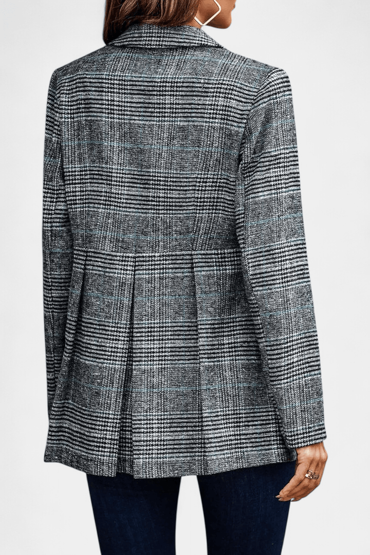 Elegant rutet peplum blazer, en mønstret dameblazer til forretningskvinden.
