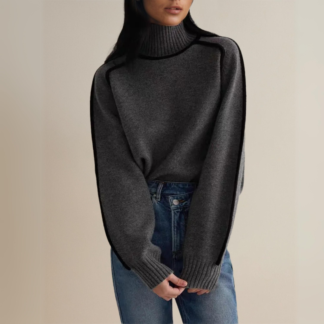 Komfortabel dame rullekravetrøje i blød strik. Med stilfuldt moderne design og elegant kontrastdetalje. Perfekt til efteråret.