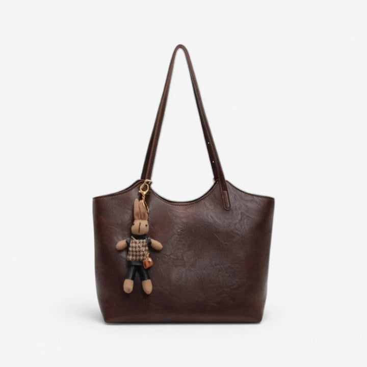 Stilfuld dame skuldertaske, moderne design, kan bruges som crossbody, med justerbare stropper.