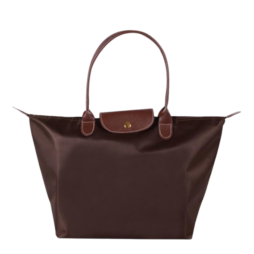 Moderne dame skuldertaske med schedel design. Justerbar rem og rummelig indre. Stilfuld dametaske.
