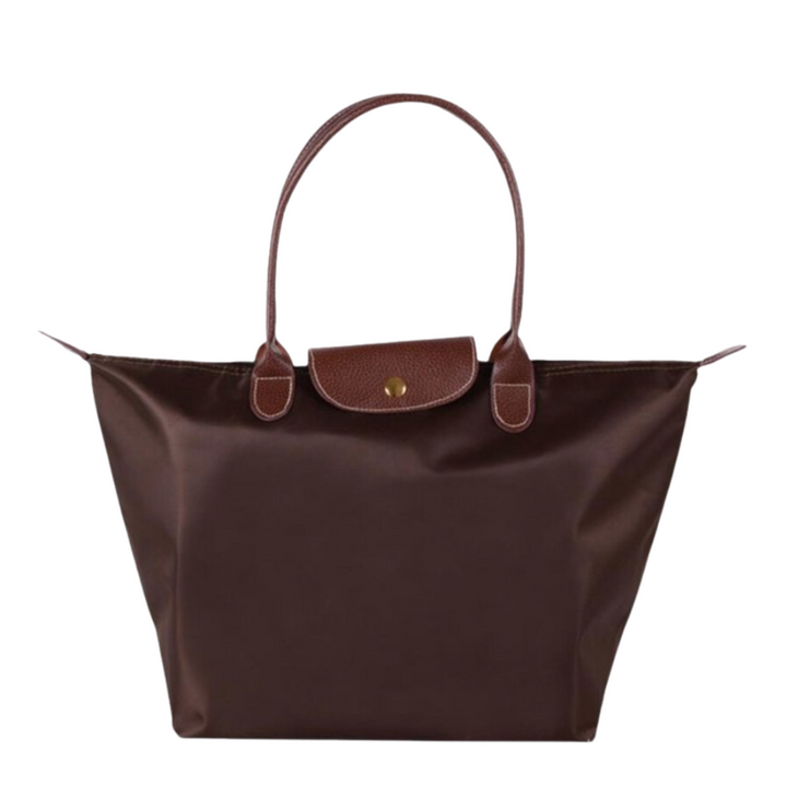 Moderne dame skuldertaske med schedel design. Justerbar rem og rummelig indre. Stilfuld dametaske.