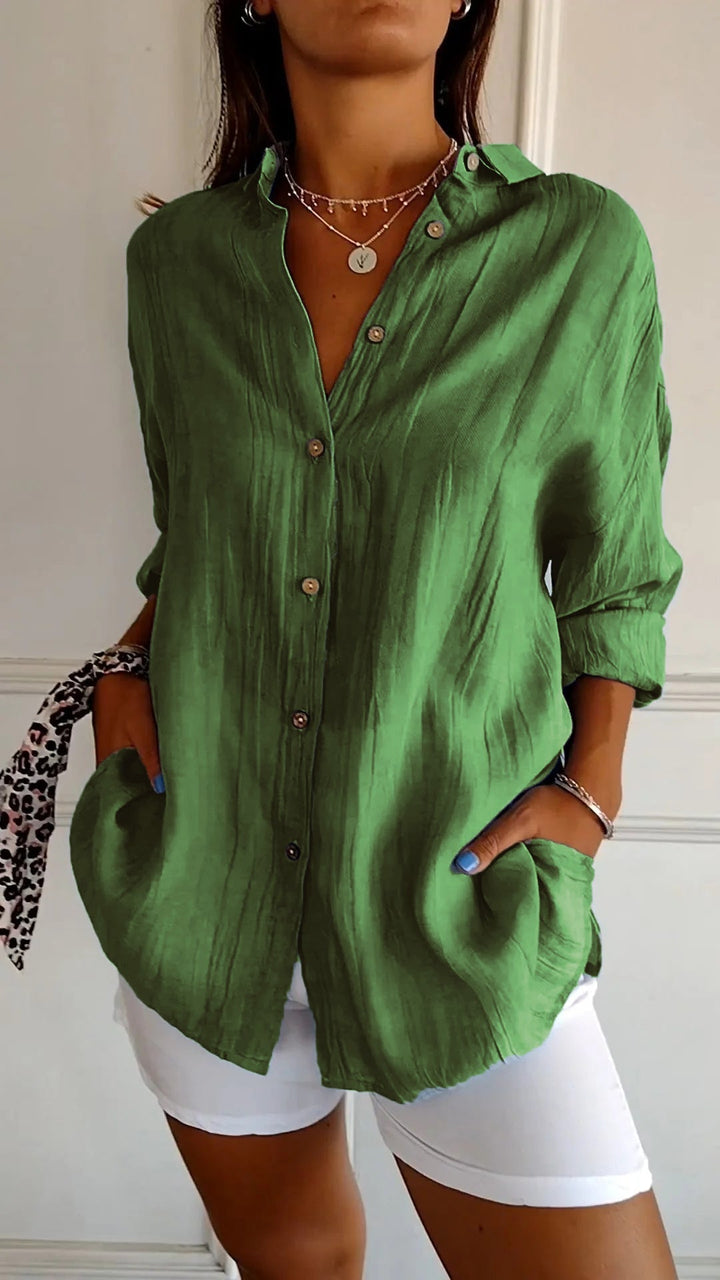 Elegant damebluse i premium materiale, klassisk stil, cremfarvet med flatterende snit, perfekt til enhver lejlighed.