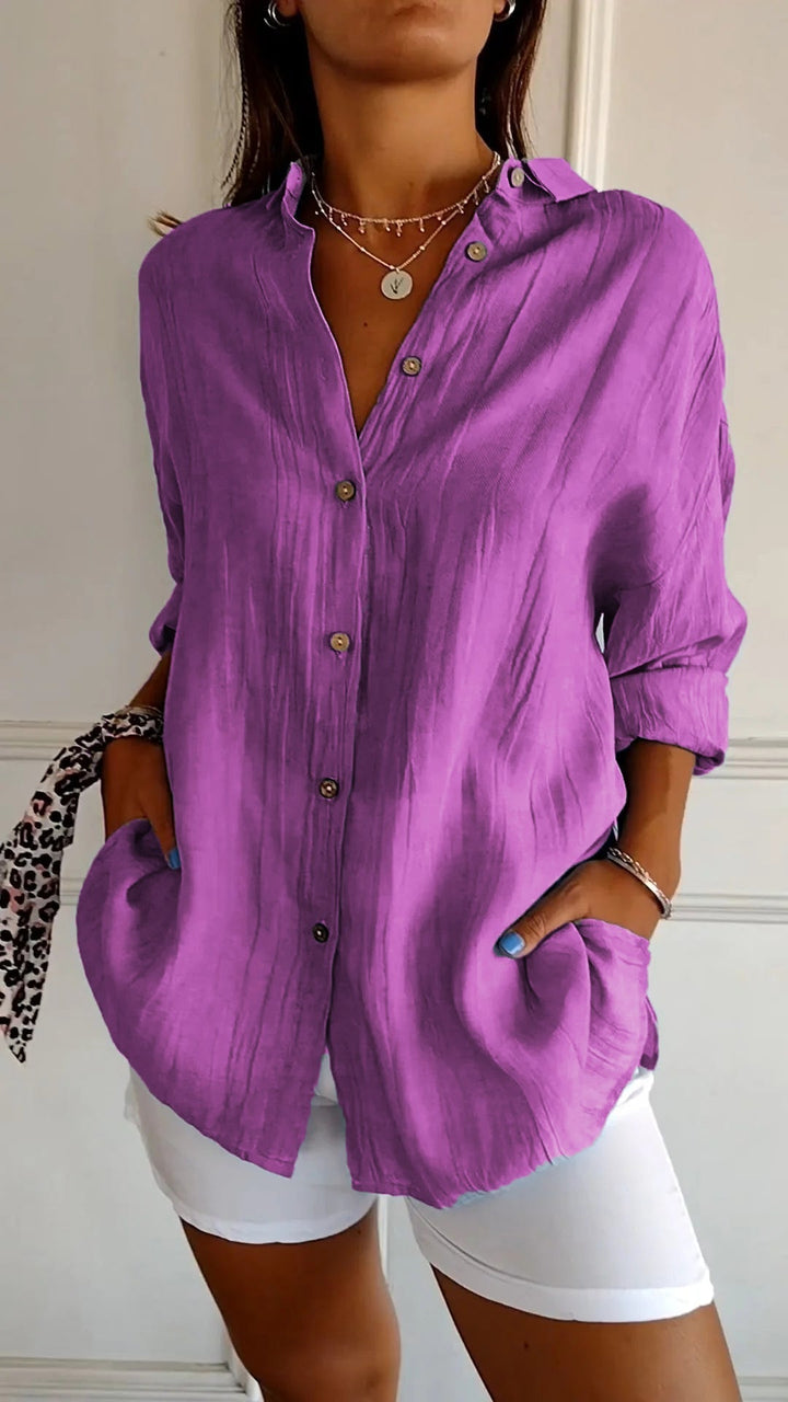 Elegant damebluse i premium materiale, klassisk stil, cremfarvet med flatterende snit, perfekt til enhver lejlighed.