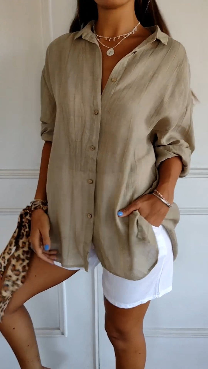 Elegant damebluse i premium materiale, klassisk stil, cremfarvet med flatterende snit, perfekt til enhver lejlighed.