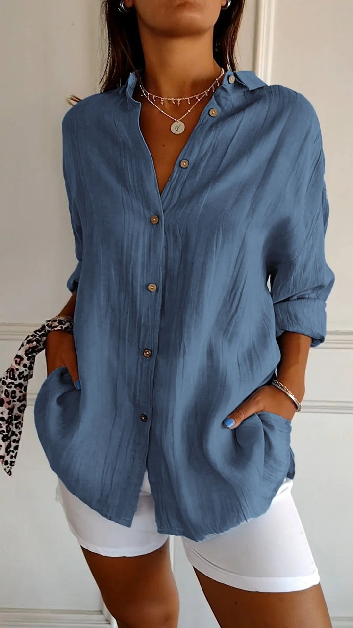 Elegant damebluse i premium materiale, klassisk stil, cremfarvet med flatterende snit, perfekt til enhver lejlighed.