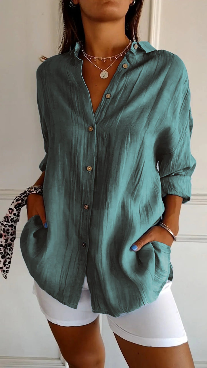 Elegant damebluse i premium materiale, klassisk stil, cremfarvet med flatterende snit, perfekt til enhver lejlighed.