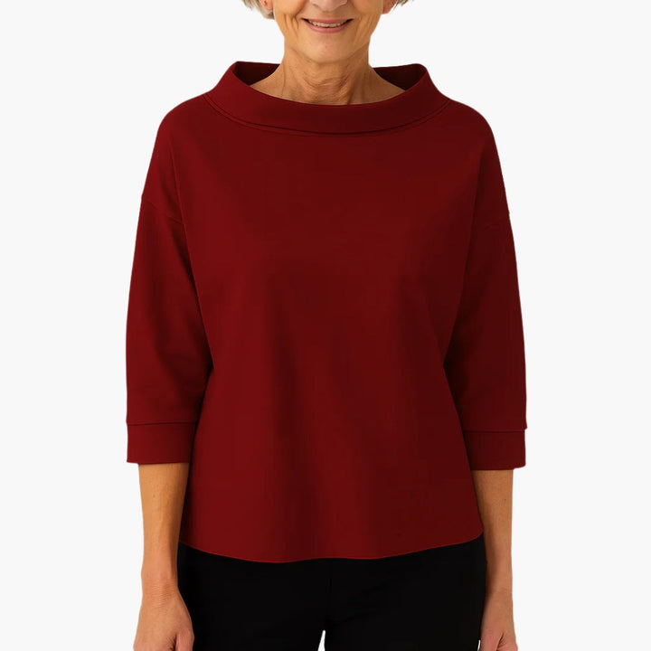 Hverdagstop med elegant bådudskæring og 3/4 ærmer. Alsidig damebluse til et moderne og stilfuldt look.