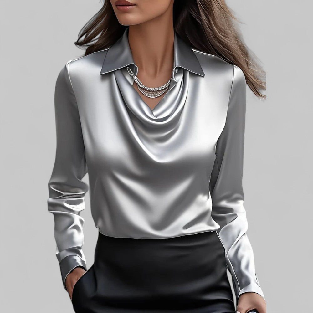 Stilfuld langærmet damebluse med moderne draperet hals. Ideel til business casual look.