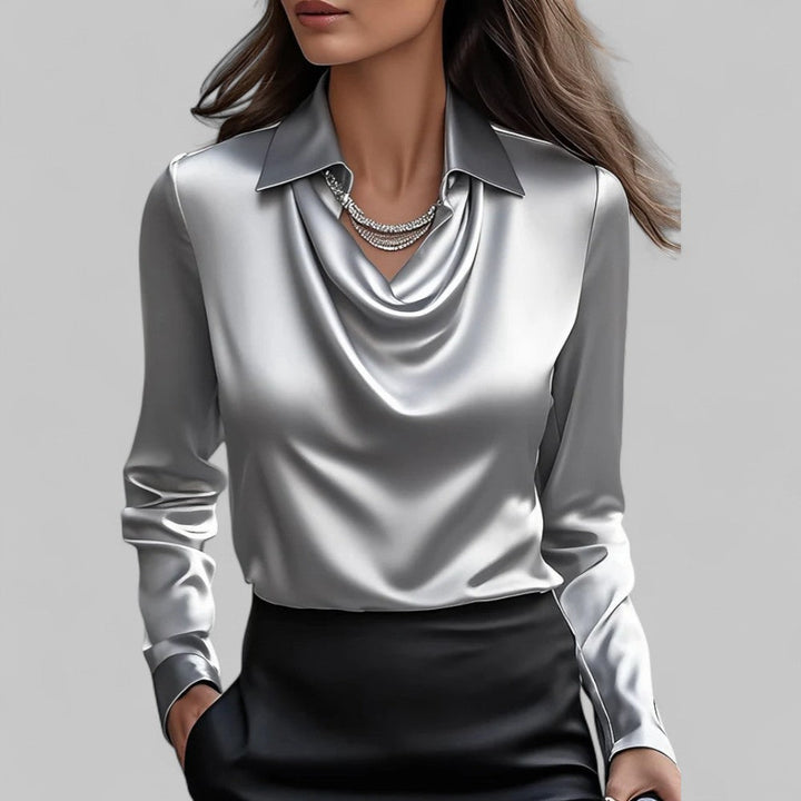 Stilfuld langærmet damebluse med moderne draperet hals. Ideel til business casual look.