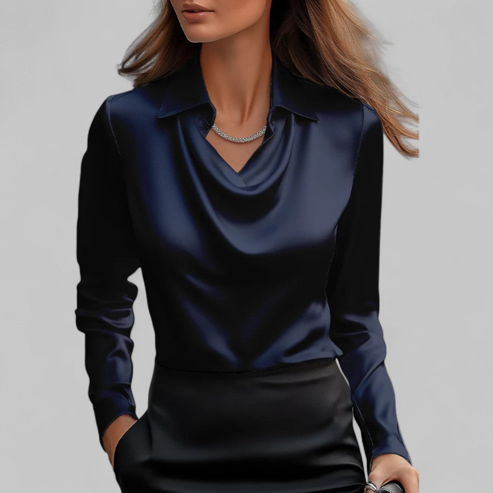 Festbluse dame med elegant draperet hals og lange ærmer. Skaber et sofistikeret udtryk.