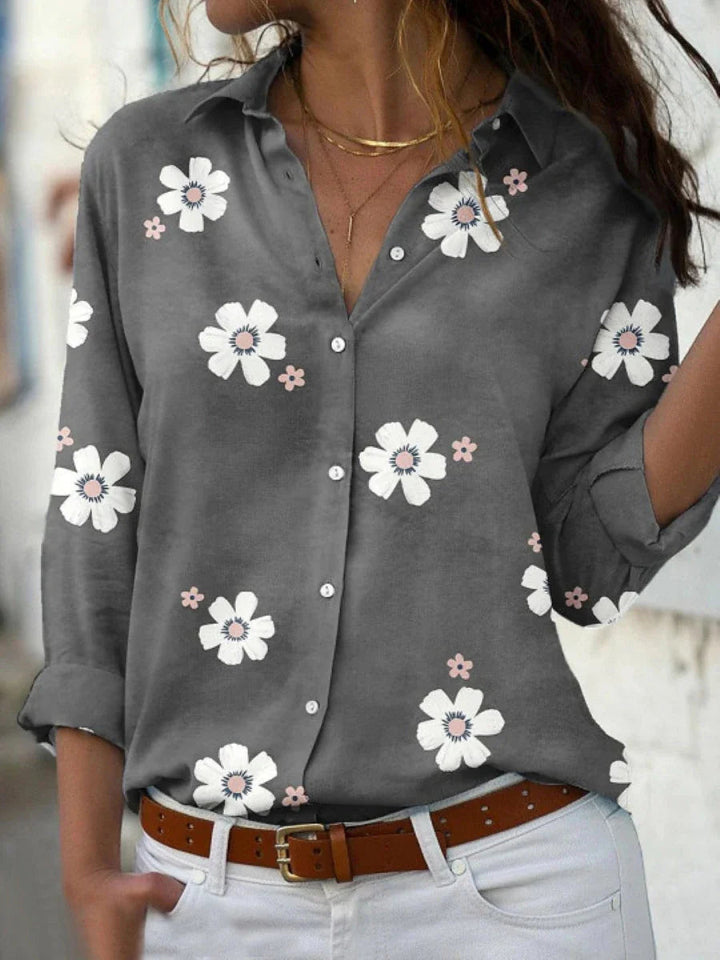 Feminin blomstret bluse til kvinder med et elegant snit. Ideel til både hverdag og festlig brug.