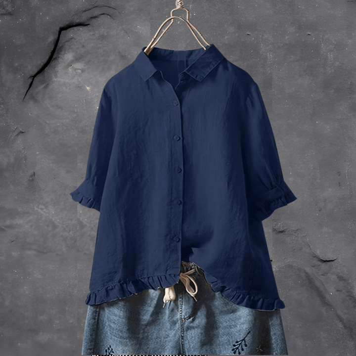 Elegant damebluse med løs pasform til hverdag. Komfortabel kortærmet sommerbluse med knapper.