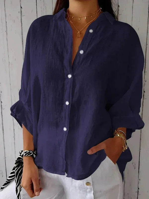 Elegant damebluse med V-hals og feminin sløjfedetalje. Perfekt til hverdag og fest.