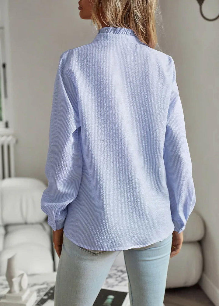 Alsidig damebluse, perfekt til både hverdag og fest. Elegant og komfortabel til alle sæsoner.