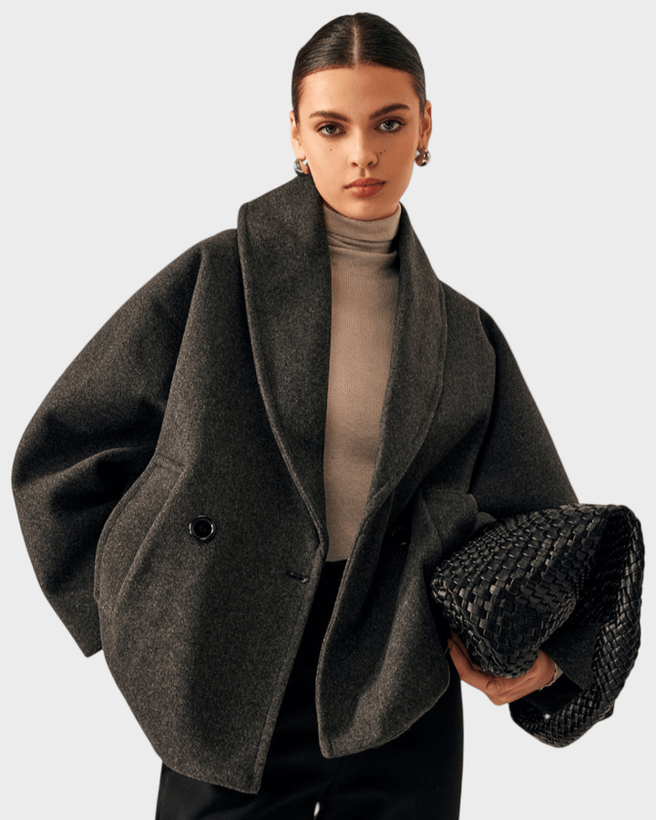 Elegant damefrakke i klassisk tweed, perfekt som overtøj til efterår og vinter.