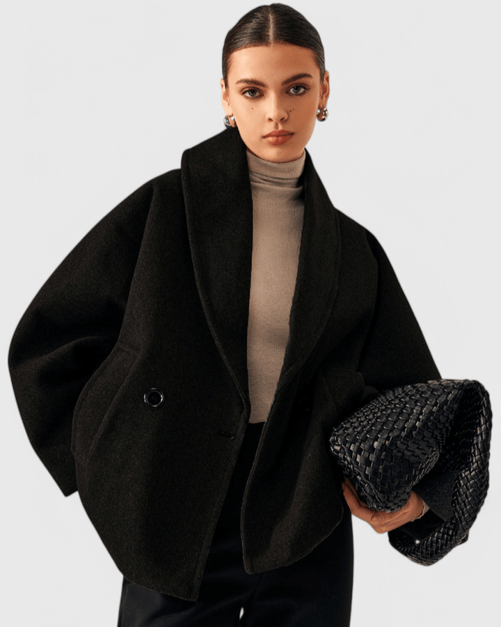 Elegant og komfortabel tweedfrakke for damer. Tidløs stil til efterårs- og vintergarderoben.
