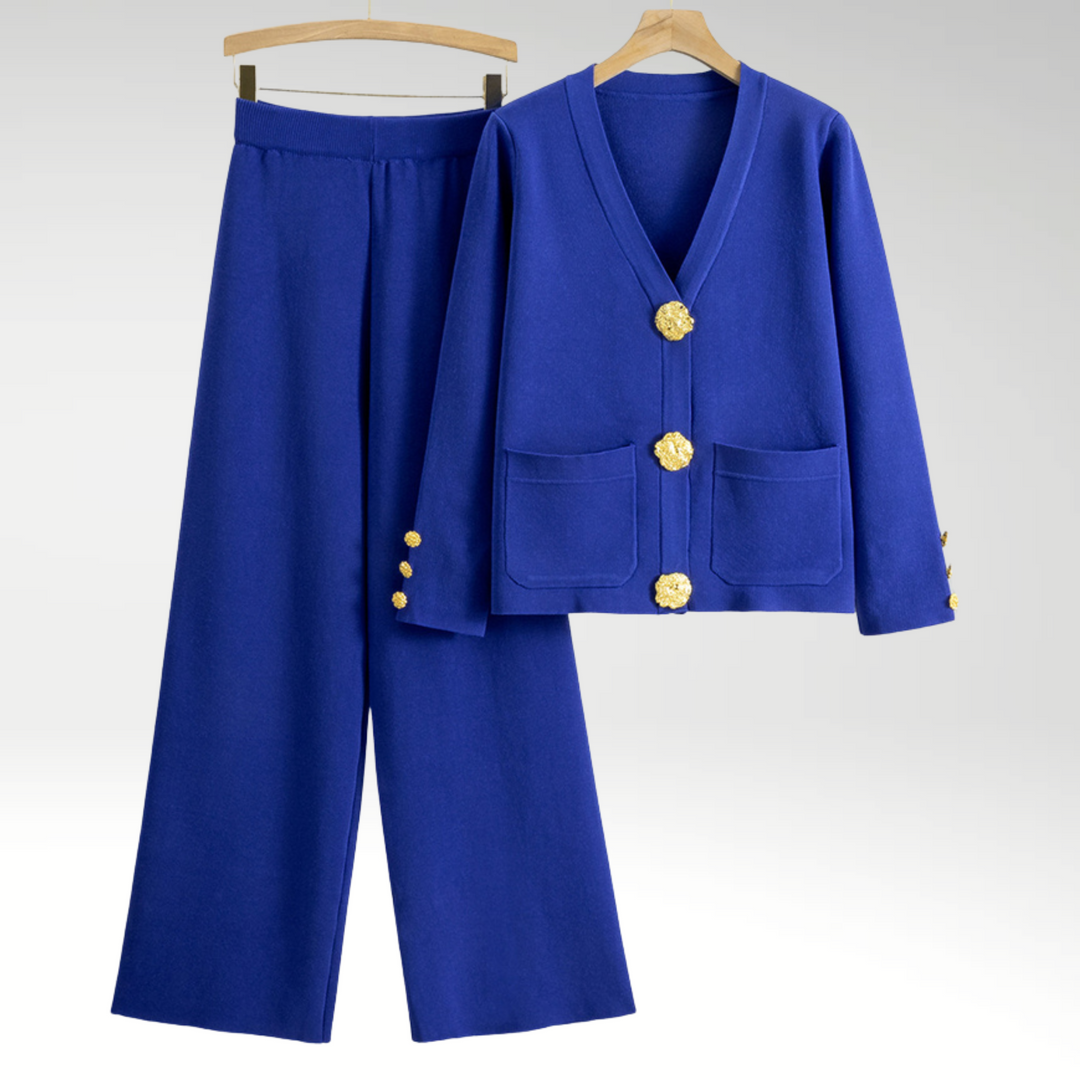 Sofistikeret damesæt: Elegant blazer og brede bukser. Moderne kvindemode med en flatterende silhuet.