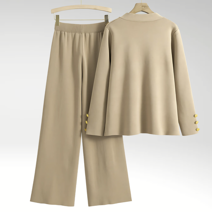 Moderne damesæt i sofistikeret design. Inkluderer blazer og brede bukser for et elegant og professionelt look.