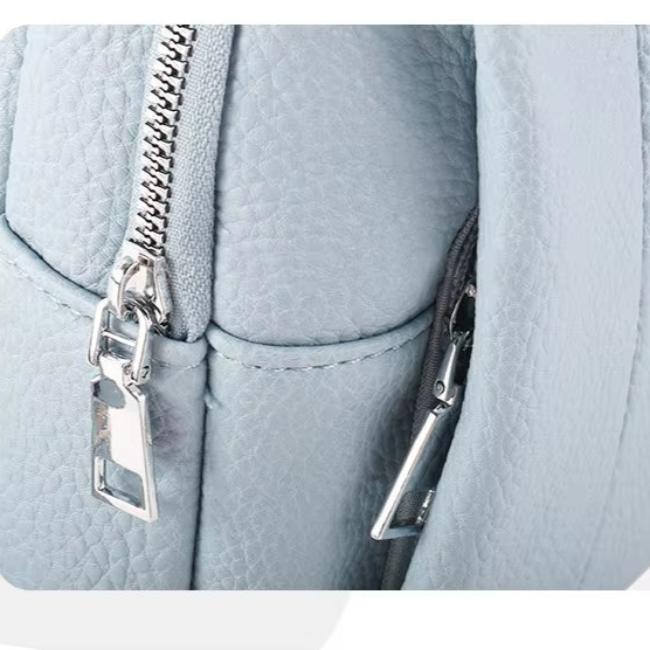 Dametaske i læder: Geometrisk crossbody med justerbar rem, stilfuld & funktionel.