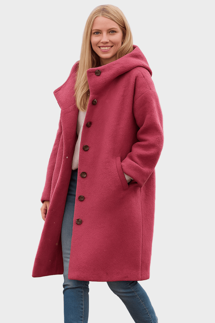 Elegant halvlang damejakke i sort, båret af model. Ideel som stilfuld overgangsjakke.