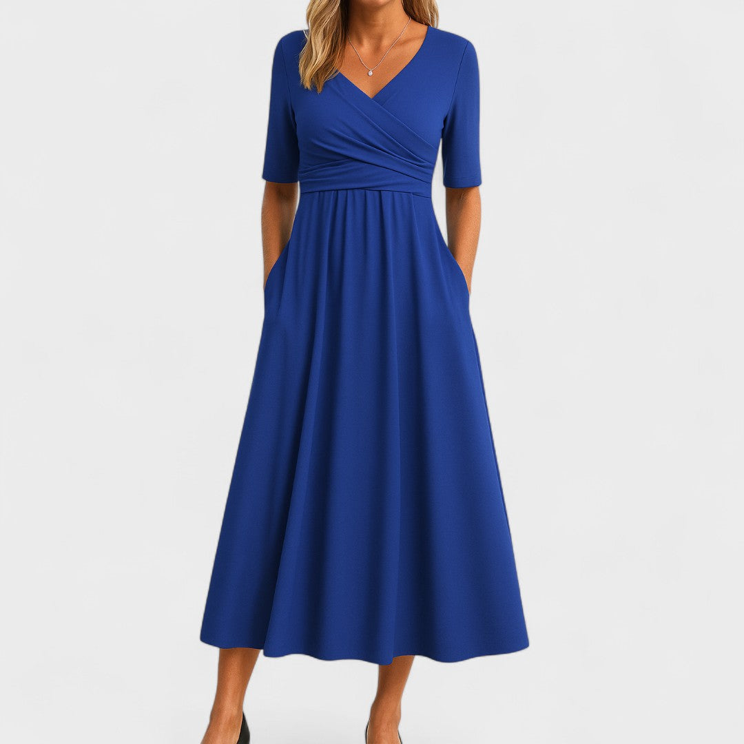 Alsidig Joanna midi festkjole til kvinder. Elegant design, behagelig pasform. Perfekt som hverdagskjole om sommeren.
