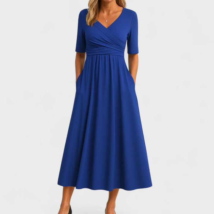 Alsidig Joanna midi festkjole til kvinder. Elegant design, behagelig pasform. Perfekt som hverdagskjole om sommeren.