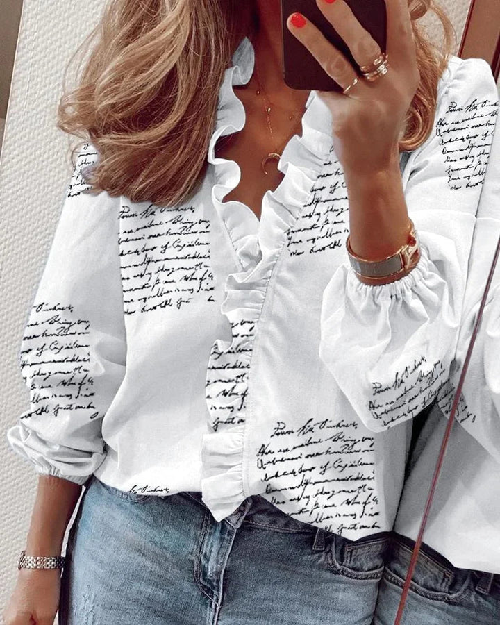 Elegant festtop til kvinder med flæser og voluminøse ballonærmer, feminin mode.