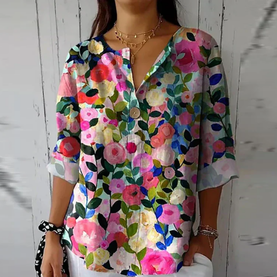 Langærmet kvindebluse med et smukt og elegant blomsterprint, ideel til både hverdag og fest.