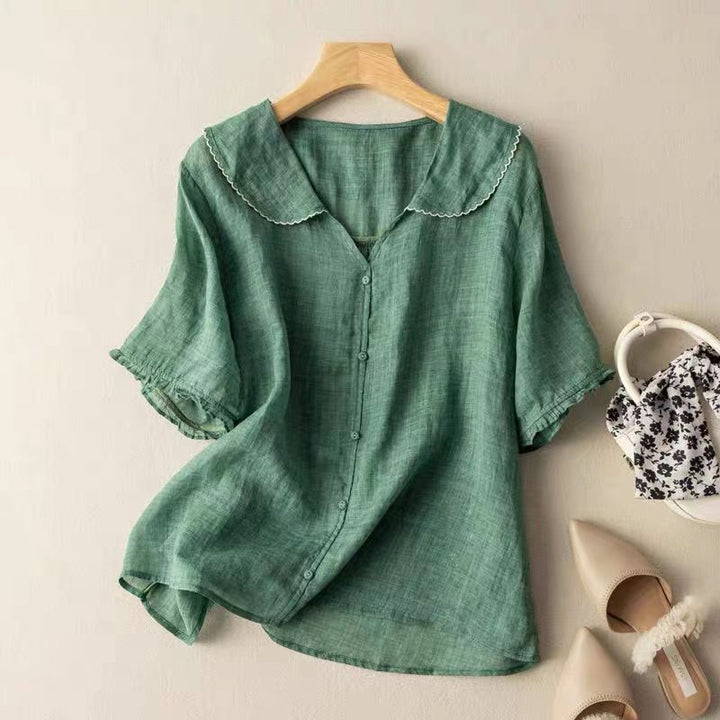 Elegant kvindebluse med vintage detaljer, langærmet og alsidig til hverdag og fest.