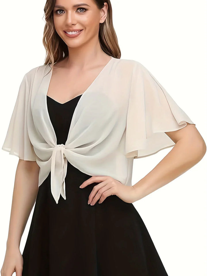 Komfortabel og elegant dame omslagsbluse med V-hals og lange ærmer, perfekt til både hverdag og fest.
