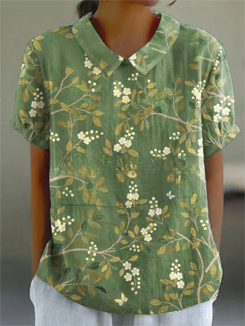 Stilfuld blomsterskjorte for kvinder, perfekt til sommerfester og elegant hverdag med sit unikke print.