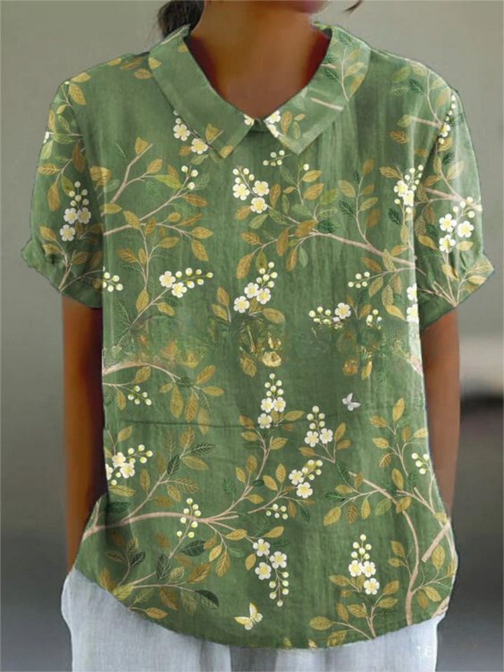 Stilfuld blomsterskjorte for kvinder, perfekt til sommerfester og elegant hverdag med sit unikke print.
