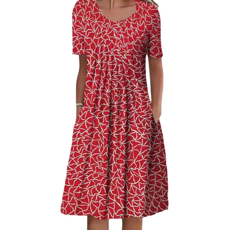 Feminine blomstret kjole med lommer, en alsidig sommerkjole, der passer til både hverdag og fest.