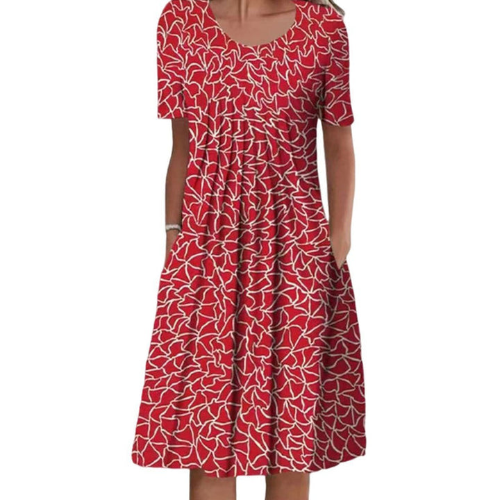 Feminine blomstret kjole med lommer, en alsidig sommerkjole, der passer til både hverdag og fest.