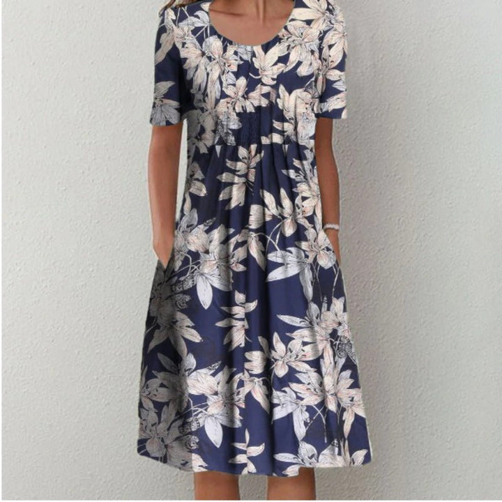 Trendy blomstret sommerkjole med lommer, designet til optimal komfort og et chic look.